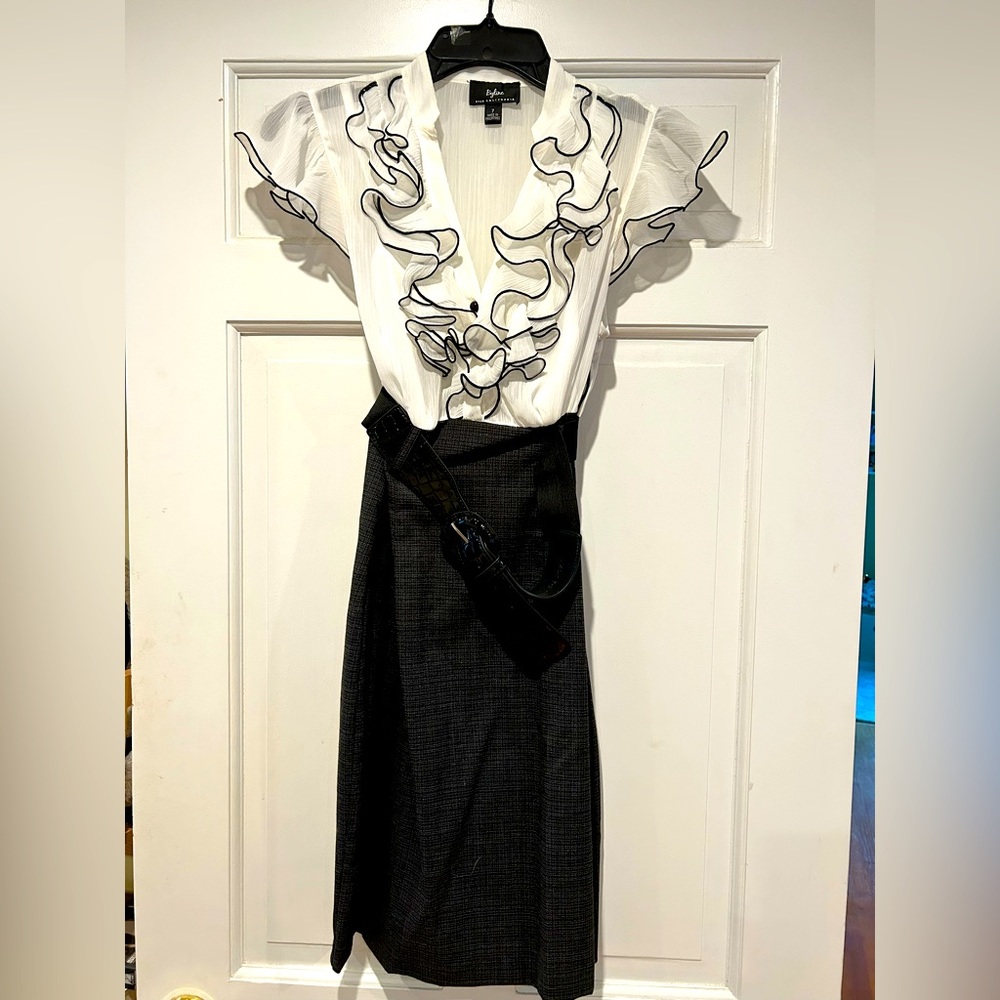 Very cute dress with black belt. Size 7